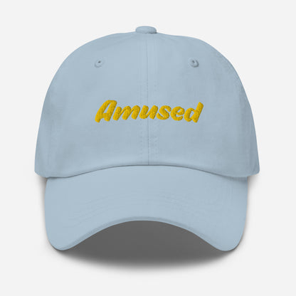 Austin city editions with “Amused” type in yellow embroidery on light blue casual dad hat front view on white background