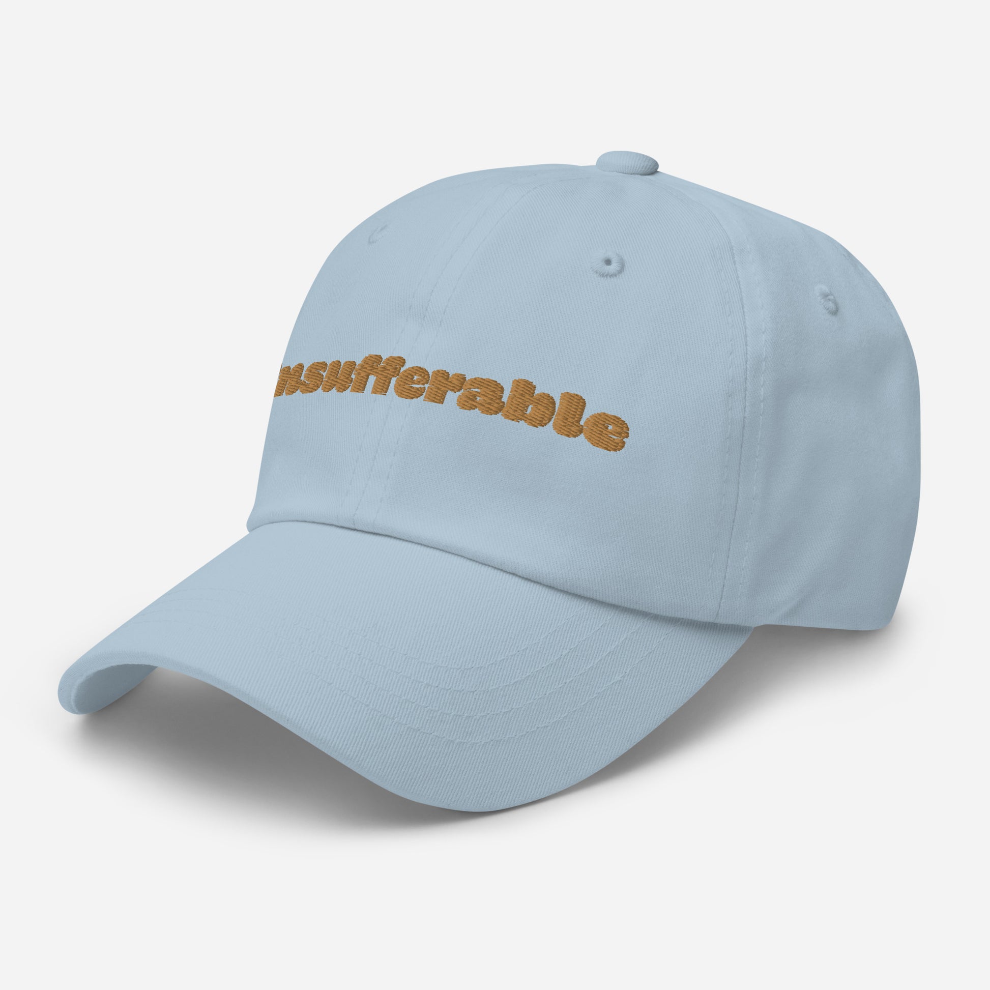 Los Angeles city editions with “Insufferable” type in gold embroidery on light blue casual dad hat front side view on white background