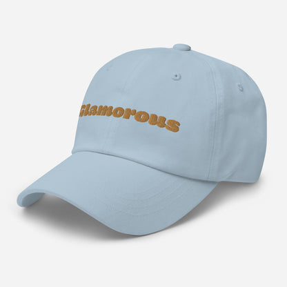 Los Angeles city editions with “Glamorous” type in gold embroidery on light blue casual dad hat front side view on white background