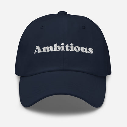 New York city editions with “Ambitious” type in white embroidery on navy casual dad hat front view on white background