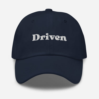 New York city editions with “Driven” type in white embroidery on navy casual dad hat front view on white background