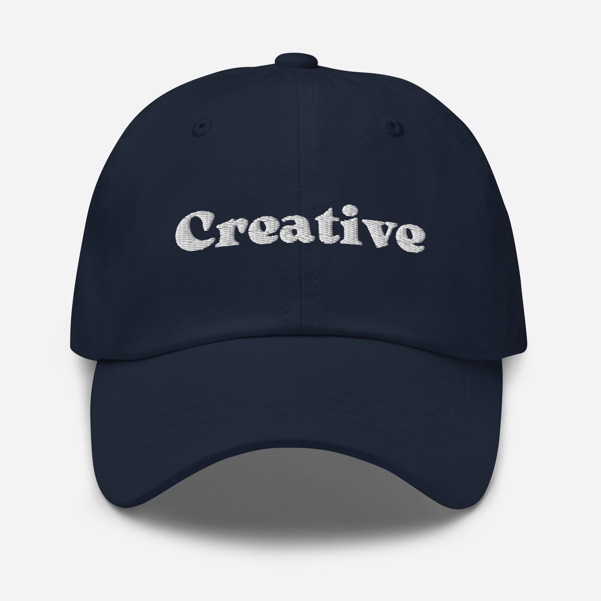 New York city editions with “Creative” type in white embroidery on navy casual dad hat front view on white background