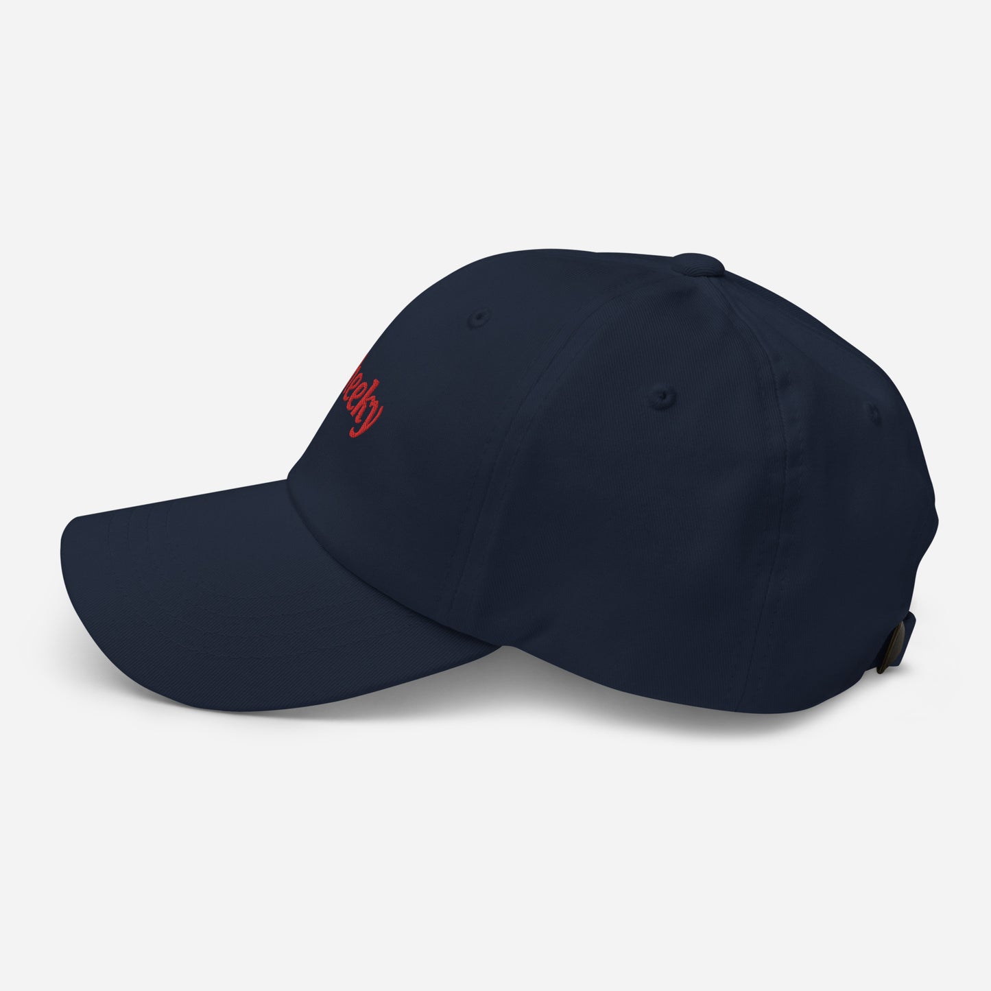 London city editions with “Cheeky” type in red embroidery on navy casual dad hat side view on white background