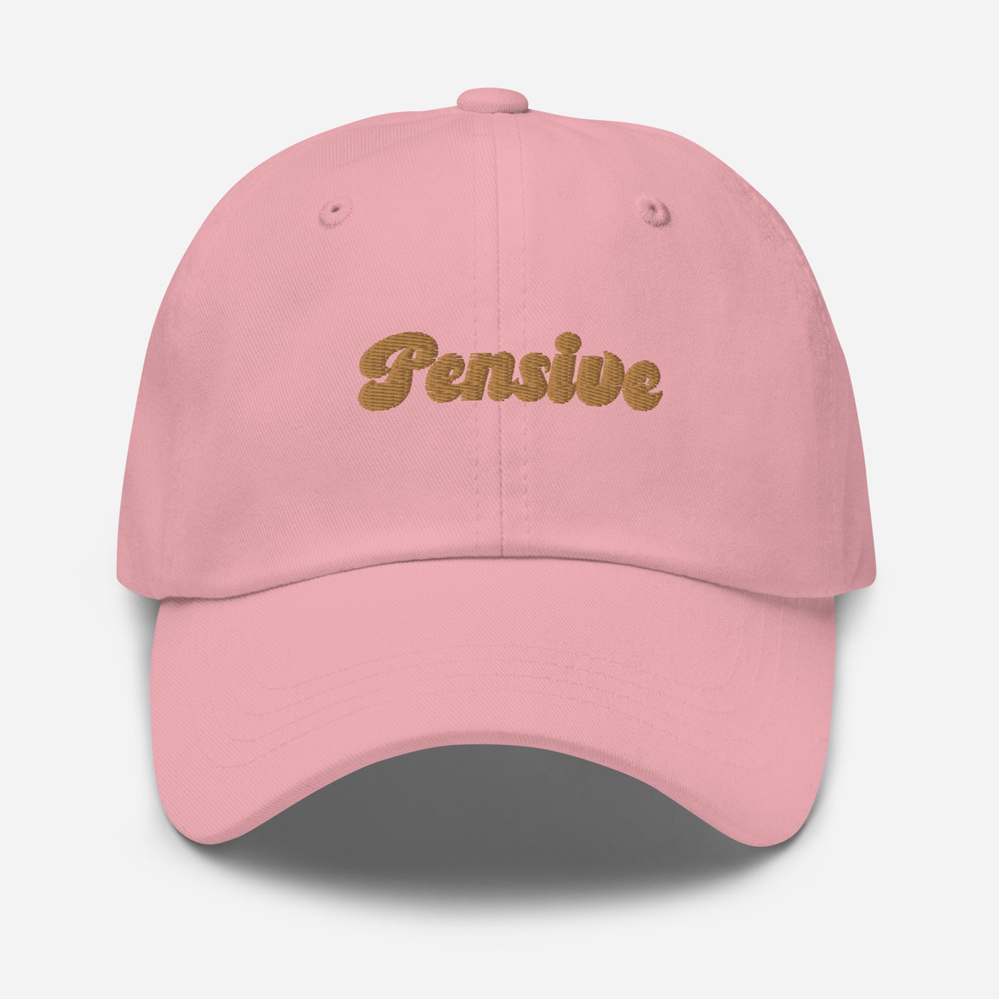 Portland city editions with “Pensive” type in gold embroidery on pink casual dad hat front view on white background