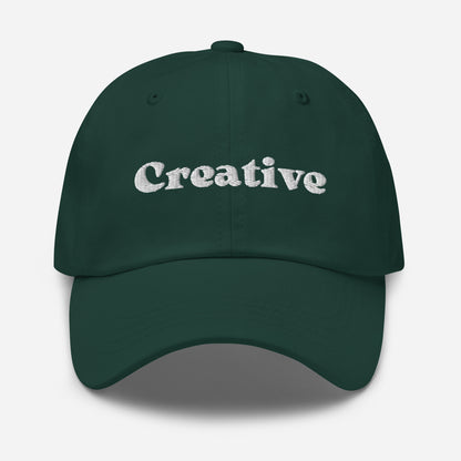 New York city editions with “Creative” type in white embroidery on green casual dad hat front view on white background