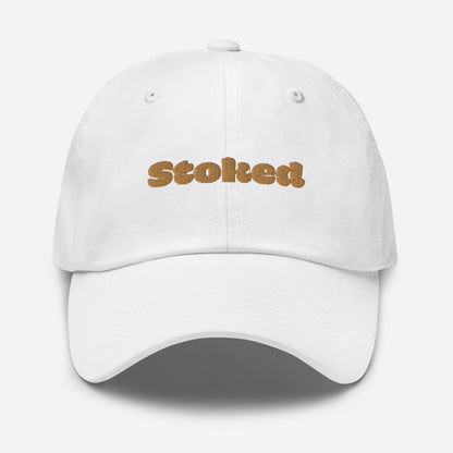 Los Angeles city editions with “Stoked” type in gold embroidery on white casual dad hat front view on white background