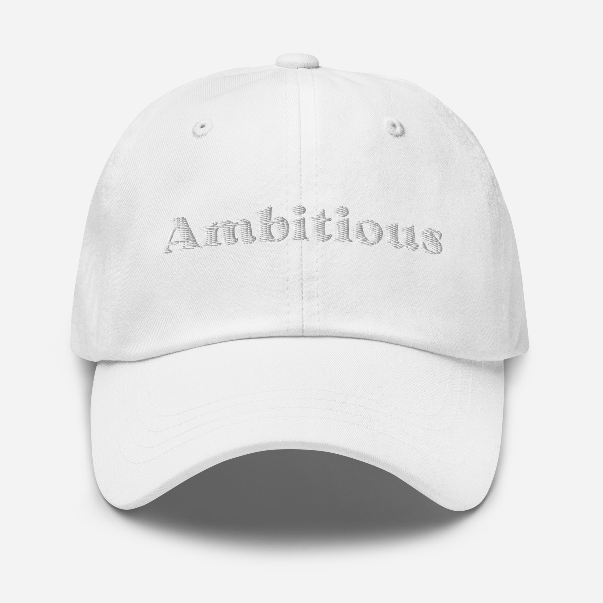 New York city editions with “Ambitious” type in white embroidery on white casual dad hat front view on white background