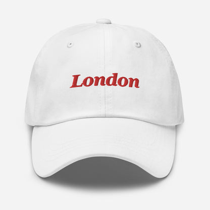 London city editions with “London” type in red embroidery on white casual dad hat front view on white background