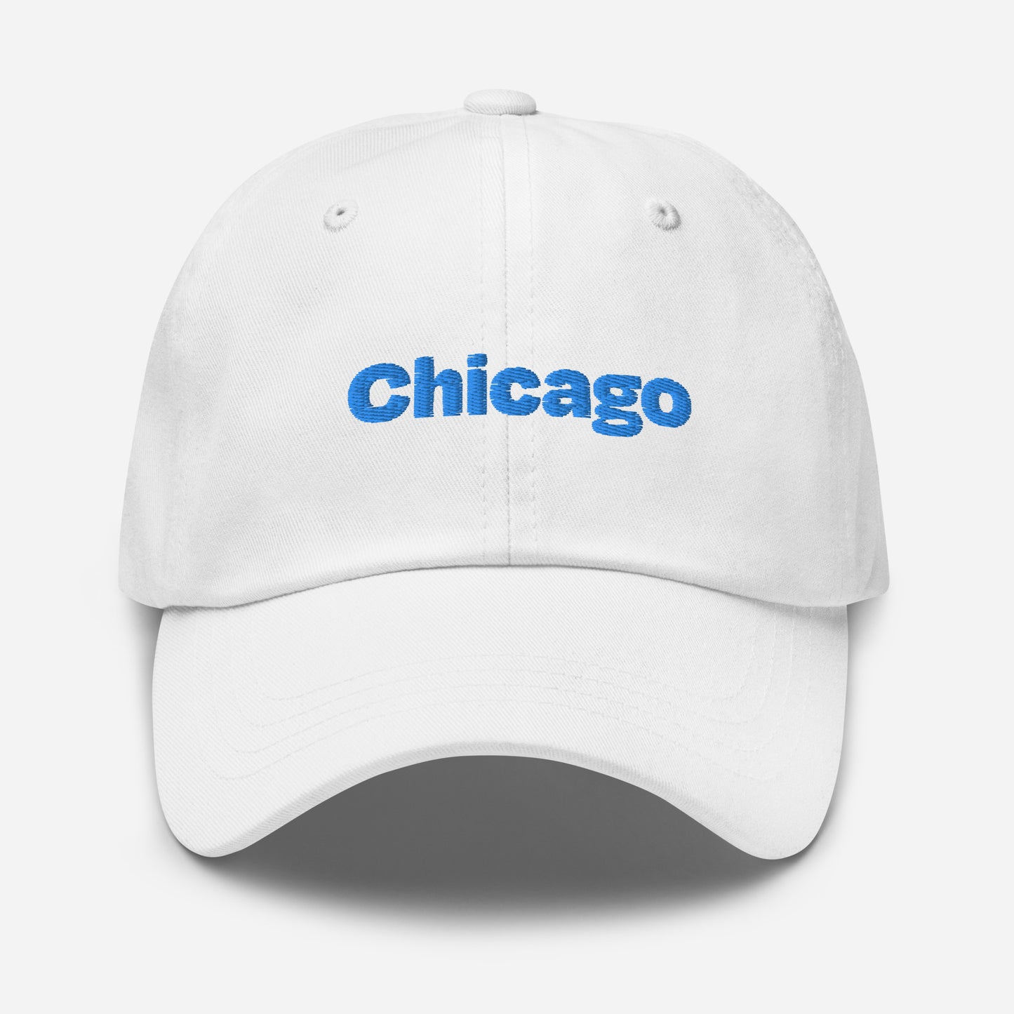 Chicago city editions with “Chicago” type in blue embroidery on white casual dad hat front view on white background