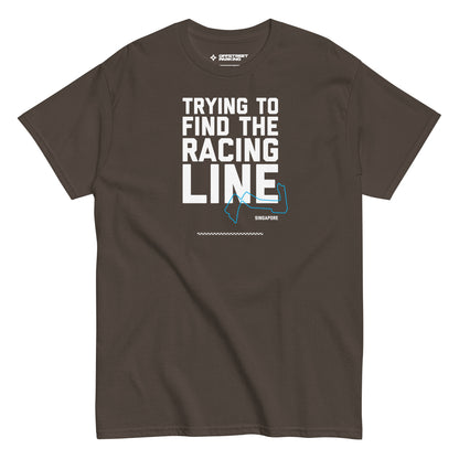 Trying To Find The Racing Line text on brown shirt, front view on white background