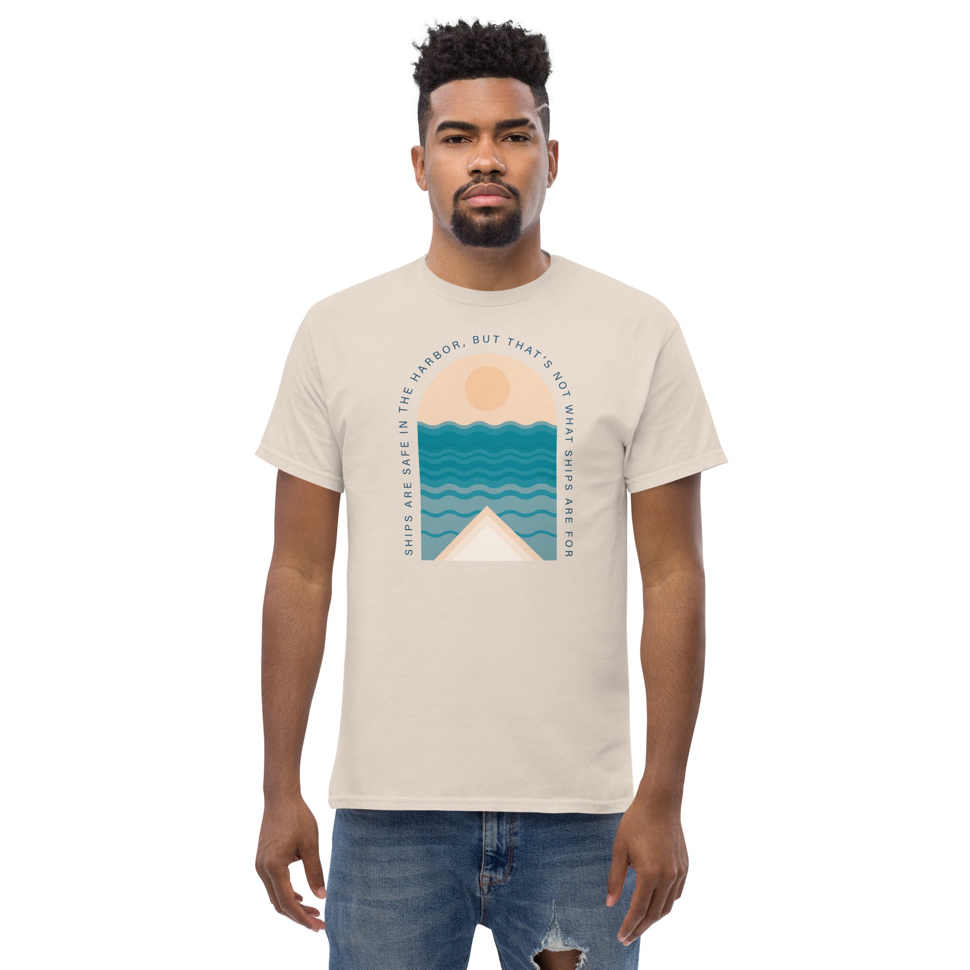 Ships Are Safe In The Harbor, But That's Not What Ships Are For text on beige t-shirt, front view on male model