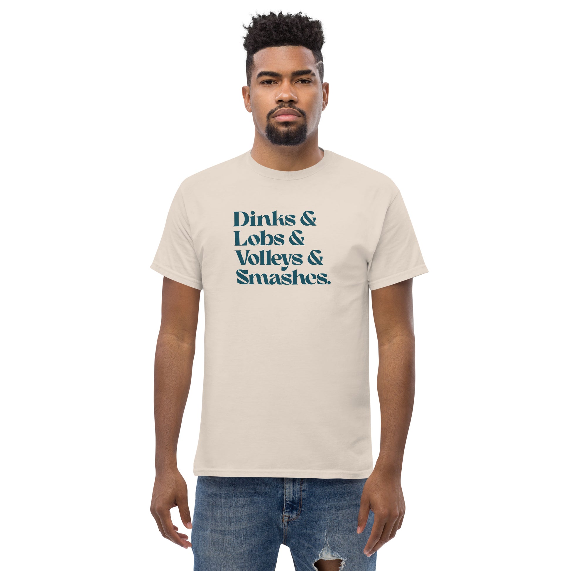 Pickleball collection with Dinks & Lobs & Volleys & Smashes dark type on sand t-shirt on male model