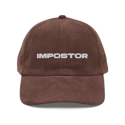 IMPOSTOR, text, type, hat, dad hat, corduroy, cozy, design. front view of brown hat on white background