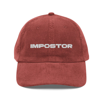 IMPOSTOR, text, type, hat, dad hat, corduroy, cozy, design. front view of rust hat on white background